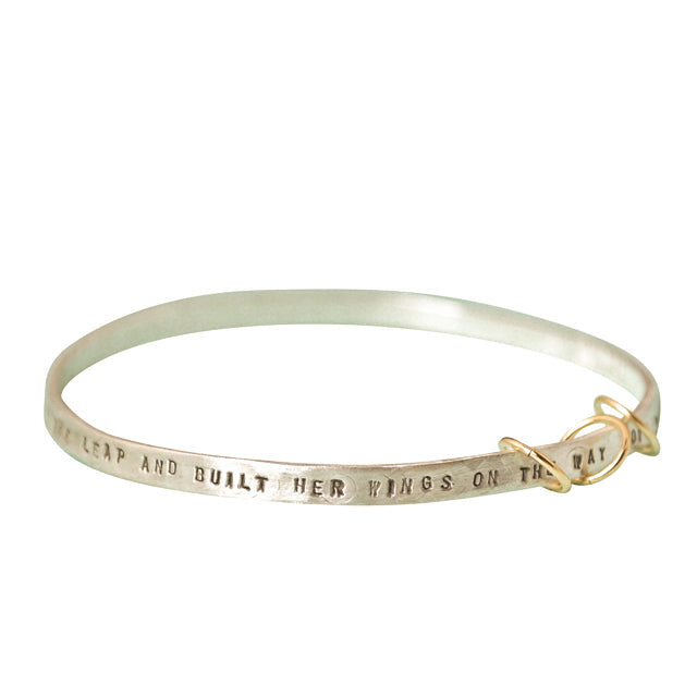 "She took the leap and built her wings on the way down" - three ring bangle