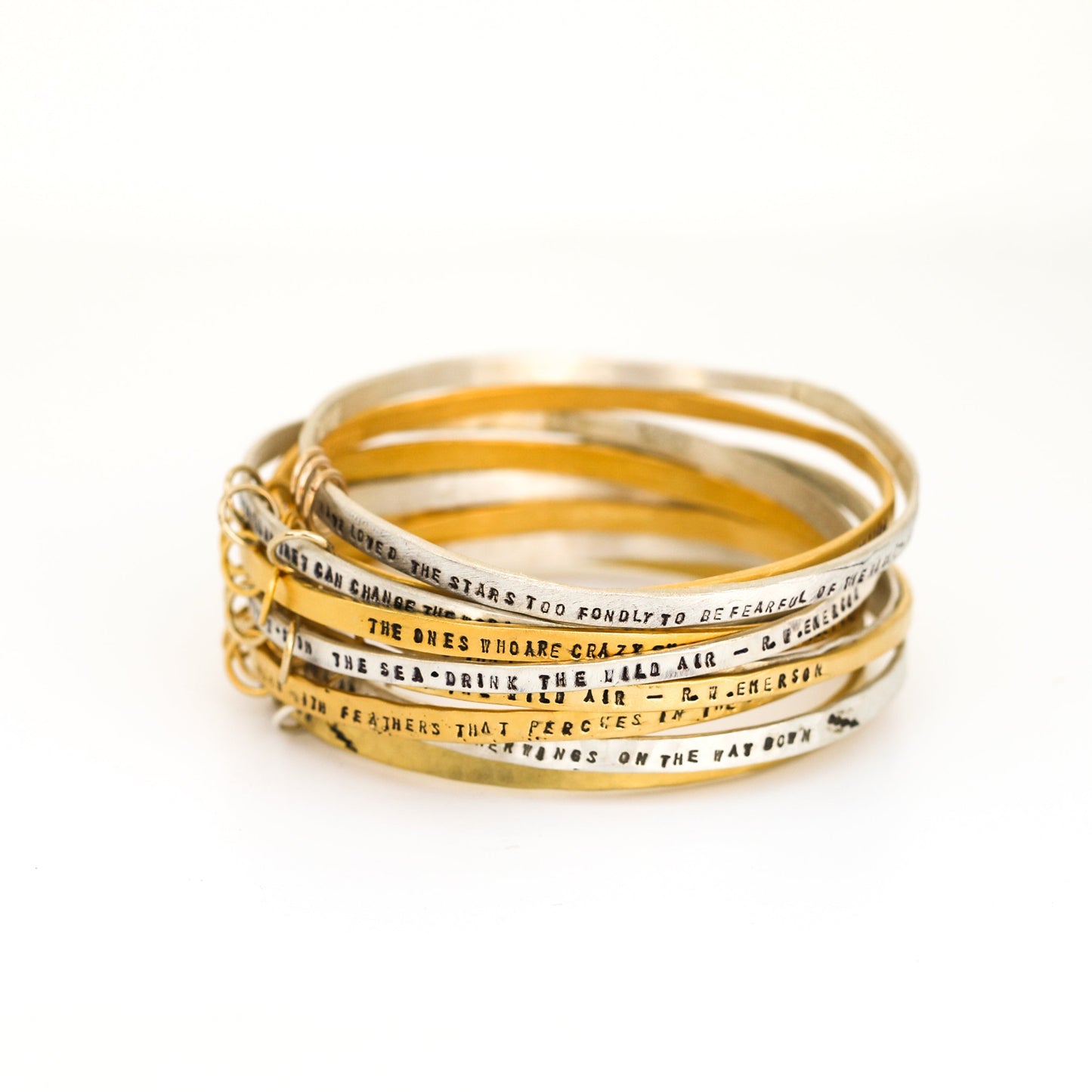 "She took the leap and built her wings on the way down" - three ring bangle