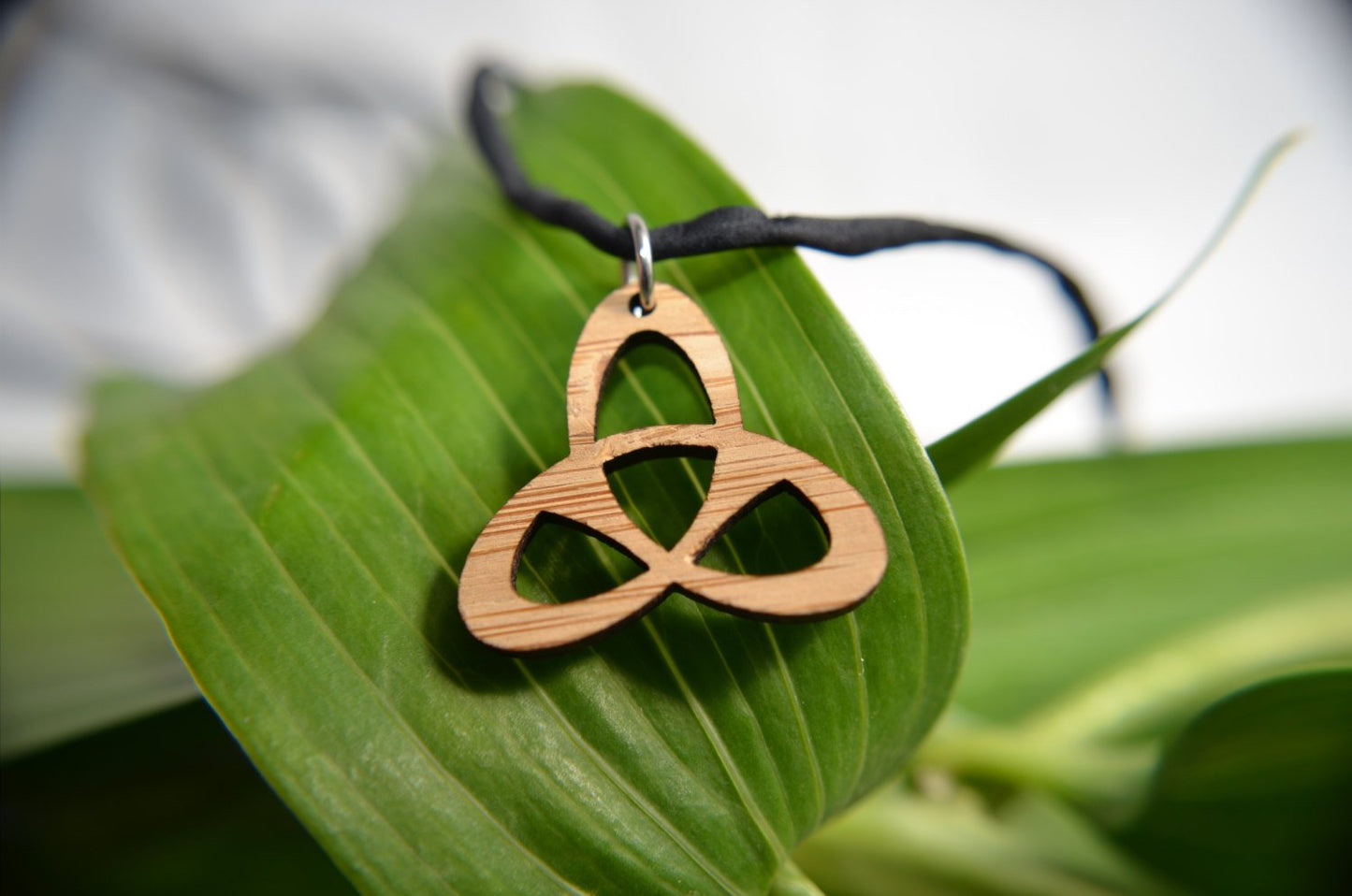 Celtic Trinity Knot Pendant in cherry on leather cord